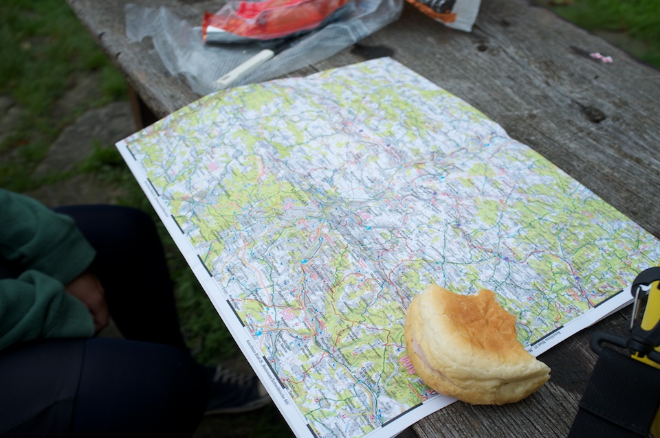 Finding our route over lunch on an old picknick bench.